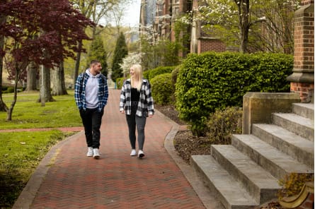 students talking on sidewalk