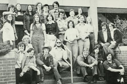 yearbook photo from the past with students on fire truck in black in white