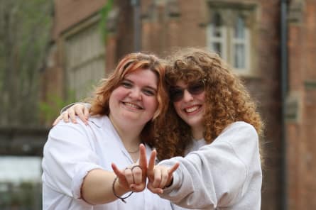 2 students smiling
