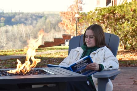 student celebrating comprehensive exams