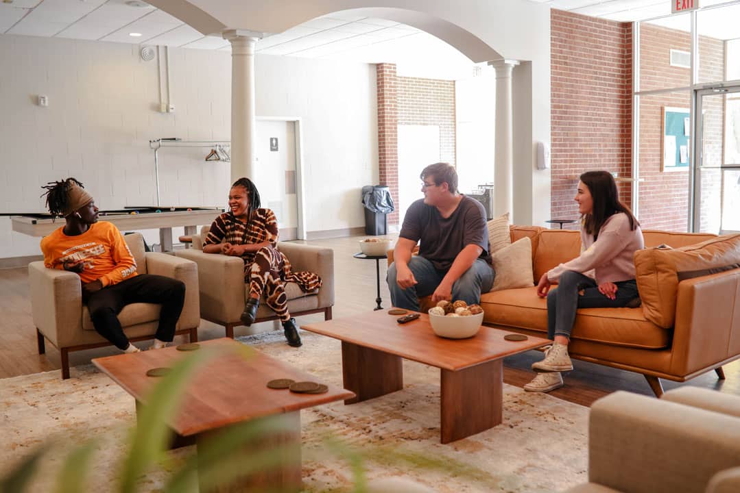 students talking on couches