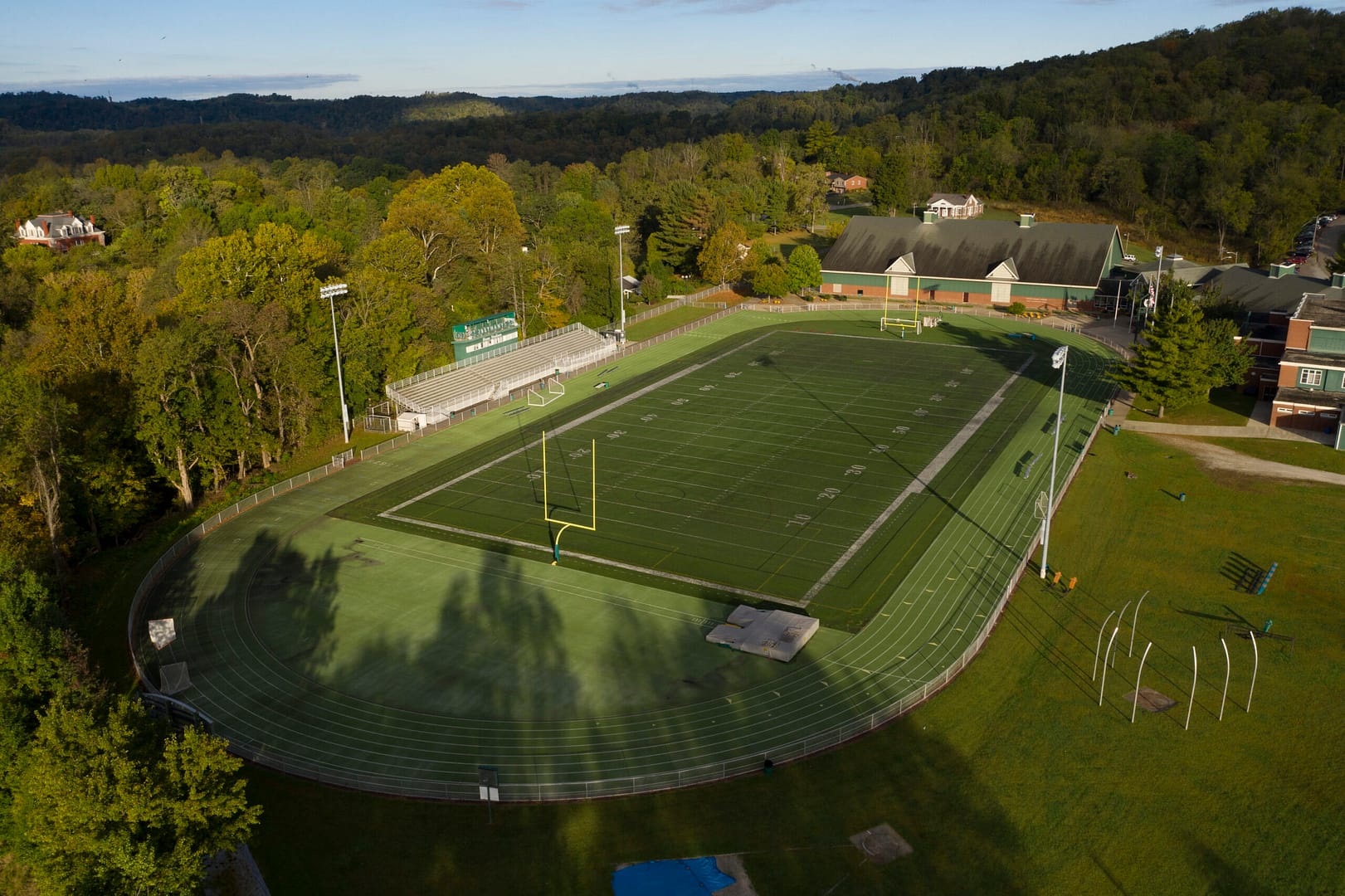 athletes playing on football field